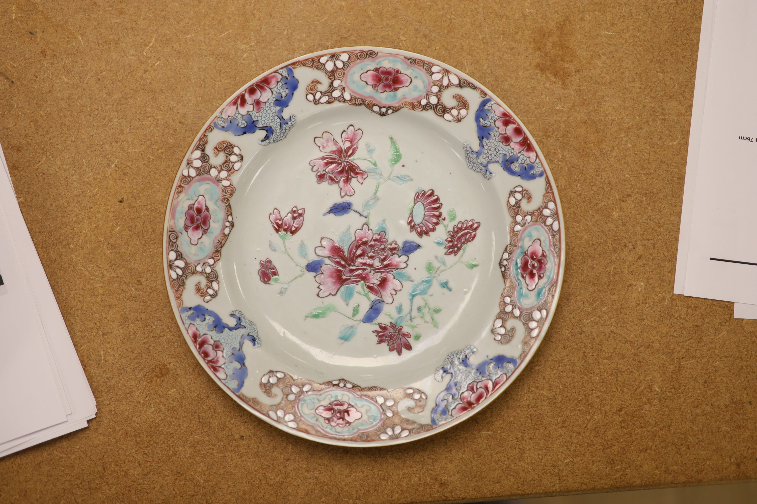 A pair of 18th century Chinese famille rose plates and another similar, largest diameter 22.5cm (damage)